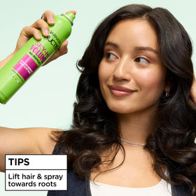 Garnier Fructis next to hairbrush showing size and styling convenience