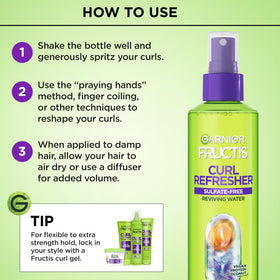 Garnier Fructis bottle held in hand to show 8.5 oz size and travel-friendly scale