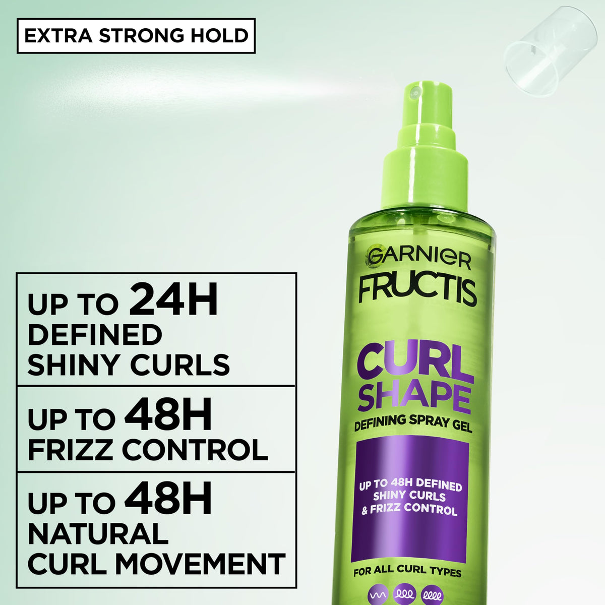 Garnier Fructis spray action misting over hair for even application and hold