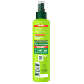 Close-up of Fructis spray mist texture highlighting Garnier formula for lightweight hold