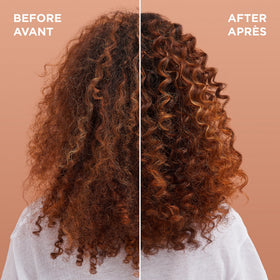 Garnier Whole Blends bottle in hand to show size and travel-friendly volume
