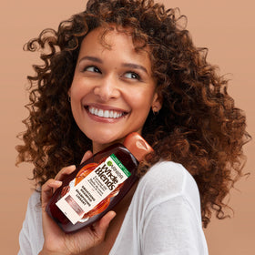 Garnier Whole Blends on bathroom shelf in lifestyle setting promoting daily use