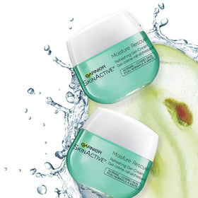 Garnier Moisture Rescue in use by sink showing quick-absorbing, non-greasy skin benefit