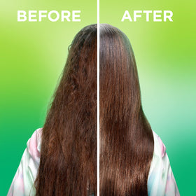 Model applying Garnier oil to hair tips for instant frizz control