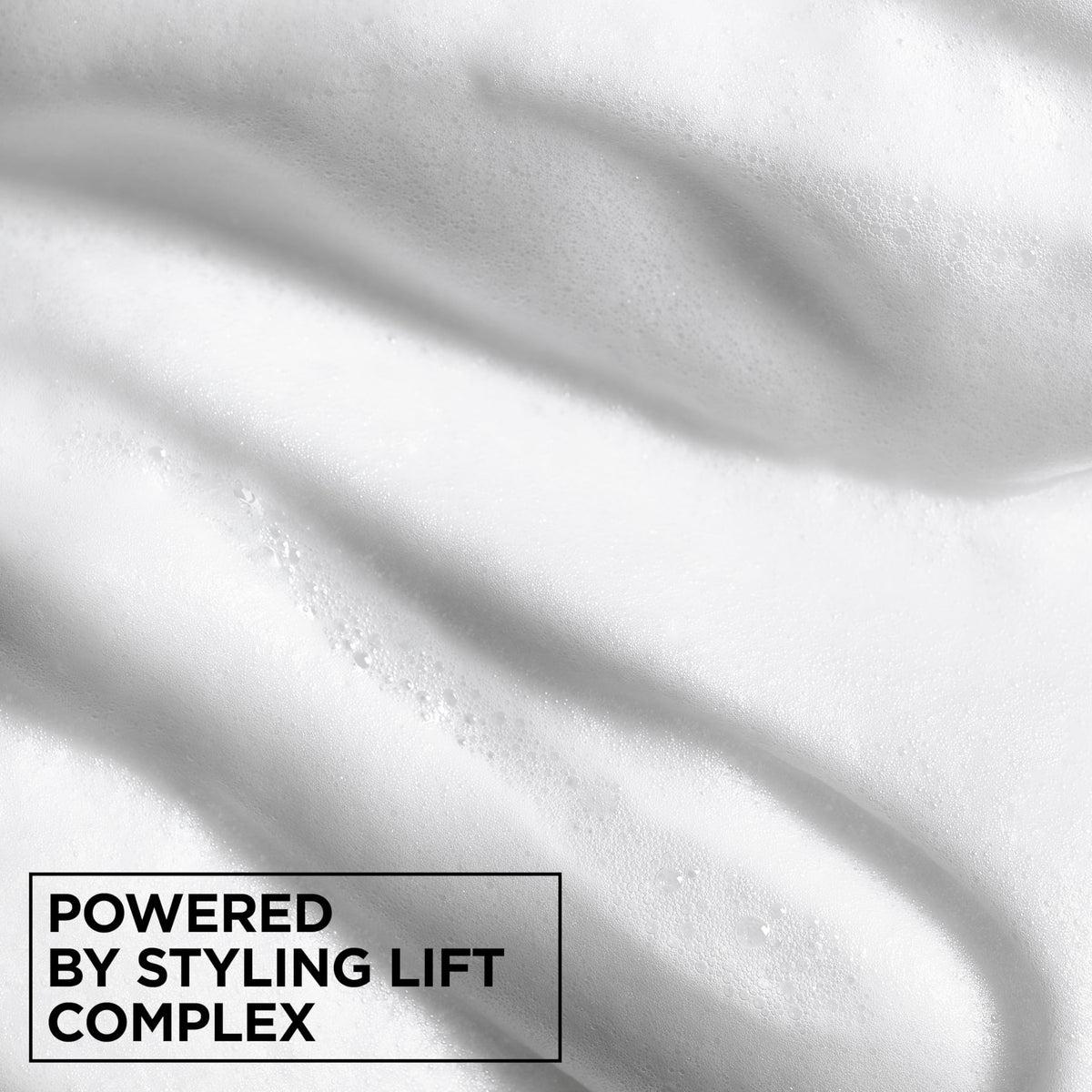 Garnier Fructis label close-up highlighting paraben-free formula and hold technology benefit
