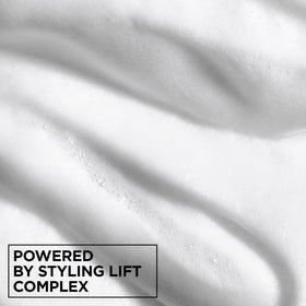 Garnier Fructis label close-up highlighting paraben-free formula and hold technology benefit