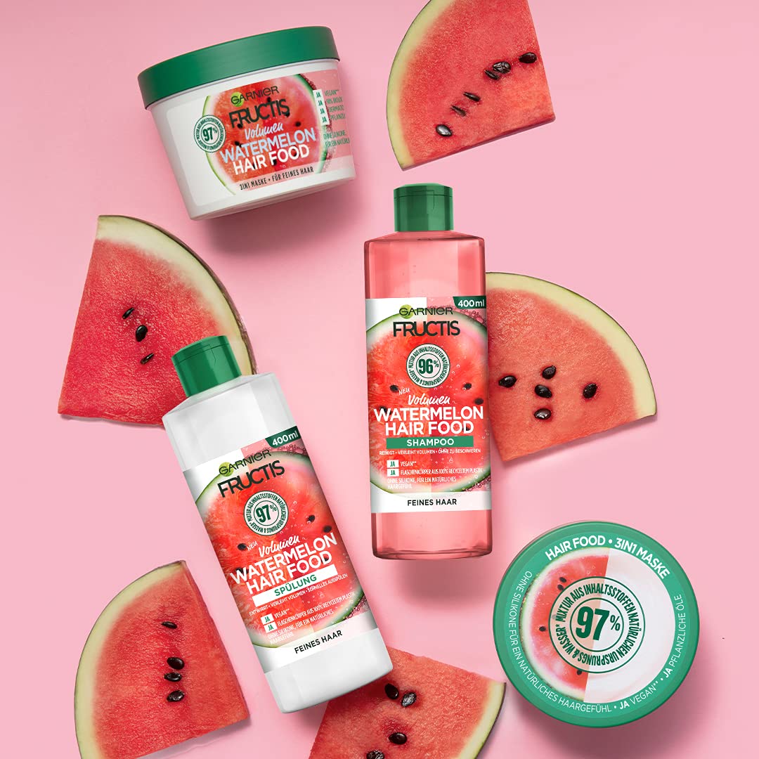 Garnier Watermelon Hair Food applied to damp hair demonstrating detangling and added shine benefits during styling