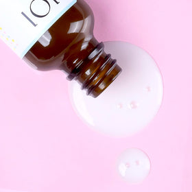 Geek & Gorgeous bottle on bathroom shelf in routine setting suggesting everyday use