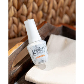 Gelish pH Bond application close-up on nail plate showing precise, quick-dry coverage to improve adhesion