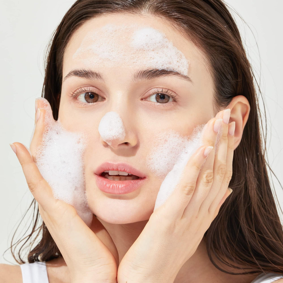 Genabelle in bathroom routine scene with mirror, brand daily skincare ritual benefit