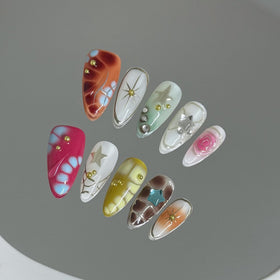 Generic close-up of 3D floral detail on nails highlighting textured accents