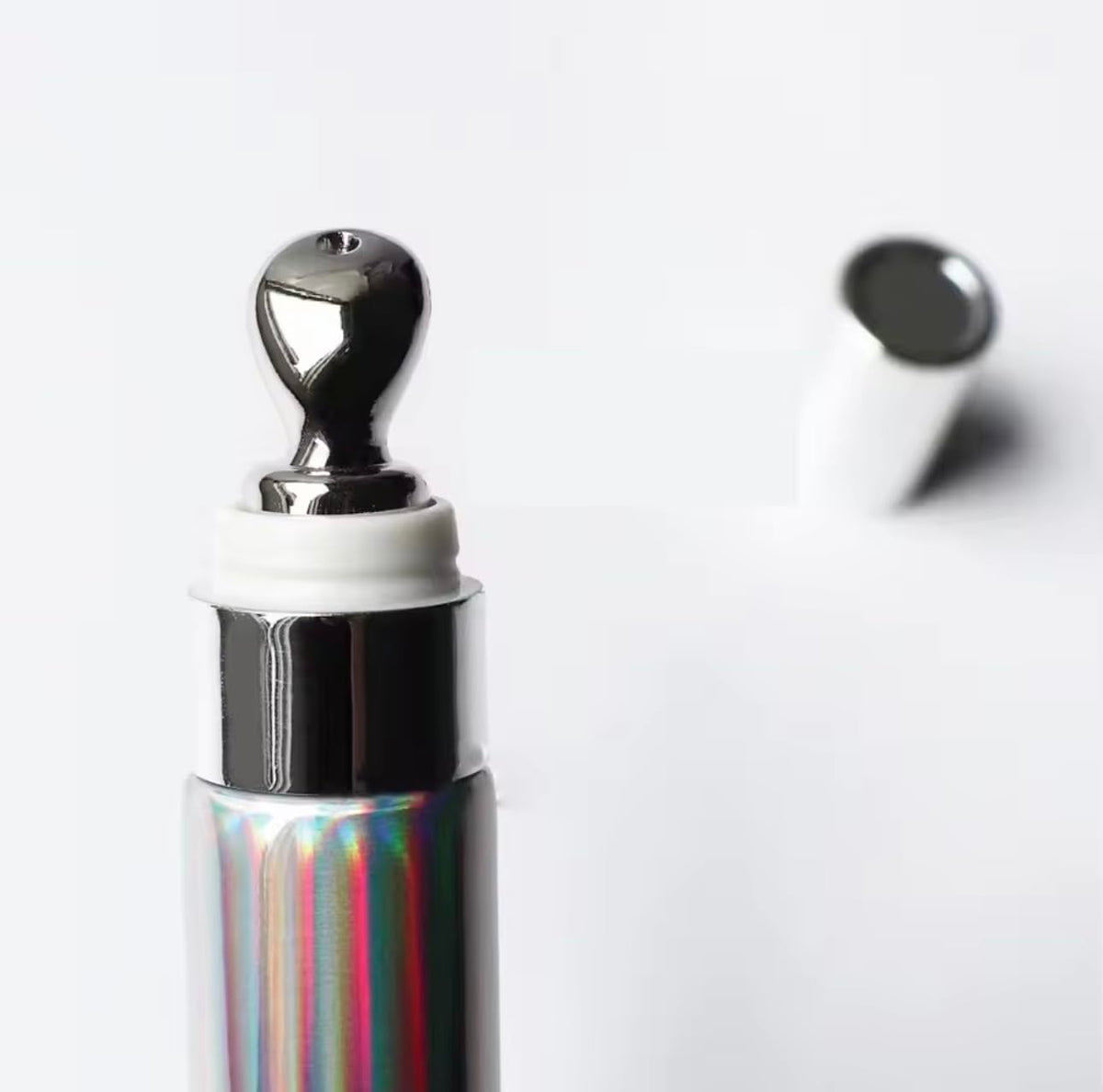 Generic extreme lipgloss applicator wand poised for smooth, precise application