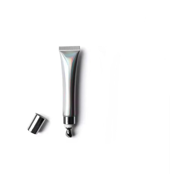Generic extreme lipgloss front packaging showing clear gloss and volume effect
