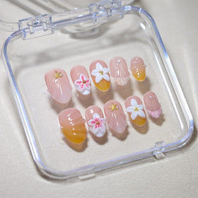 Generic hands wearing press-ons at the beach, Generic nails add vacation-ready polish