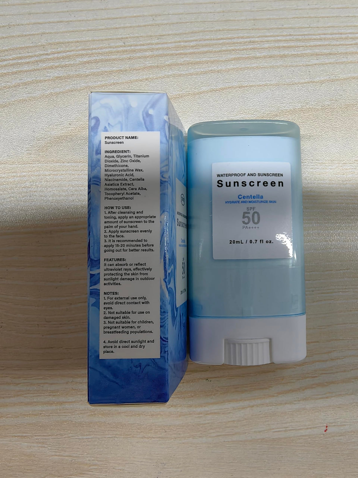 Generic suncream stick in beach setting offering broad-spectrum outdoor protection