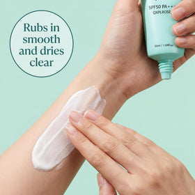 Generic sunscreen tinted swatch on arm demonstrating sheer no-white-cast finish