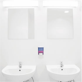 Genuine Joe size comparison next to soap dispenser demonstrating capacity and economy