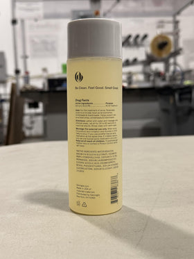Geologie bottle held in hand showing 8.4 fl oz size and portability
