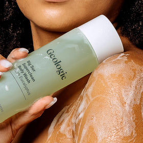 Geologie refill pouch next to bottle showing eco-friendly refill benefit