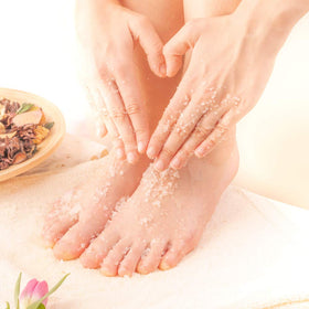 Ginger Lily Farms scrub staged in bathroom setting showing spa-ready convenience
