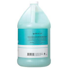 Ginger Lily Farms label detail on gallon jug highlighting vegan, PETA-certified benefits