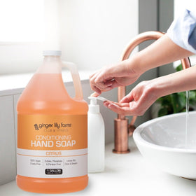 Ginger Lily Farms at a gym sink illustrating durable, pleasant-smelling soap for members