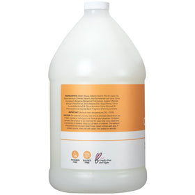 Ginger Lily Farms pouring refill into dispenser for economical and eco-friendly use