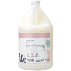 Ginger Lily Farms pouring refill into dispenser, demonstrates easy refill convenience