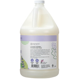 Ginger Lily Farms pouring refill into dispenser, demonstrates easy refill and savings