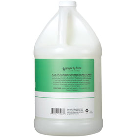 Ginger Lily Farms pouring refill into dispenser for eco-friendly bulk use