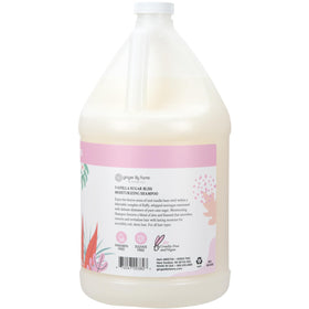 Ginger Lily Farms shampoo being poured from gallon into dispenser for refill convenience