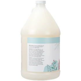 Ginger Lily Farms pouring refill into dispenser for economical benefit