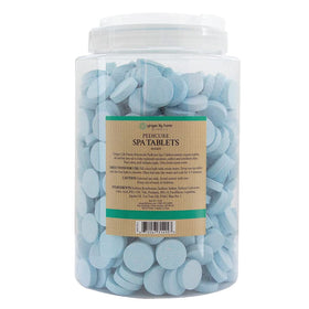 Ginger Lily Farms tablet close-up showing effervescent texture and fast dissolve benefit