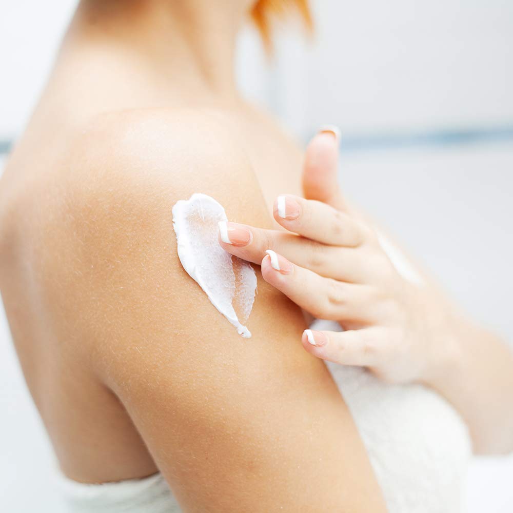 Ginger Lily Farms lotion in spa setting demonstrating gentle care for sensitive skin