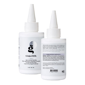 Ginger Milk Natural Care 4 oz bottle held next to a hand for size and portability
