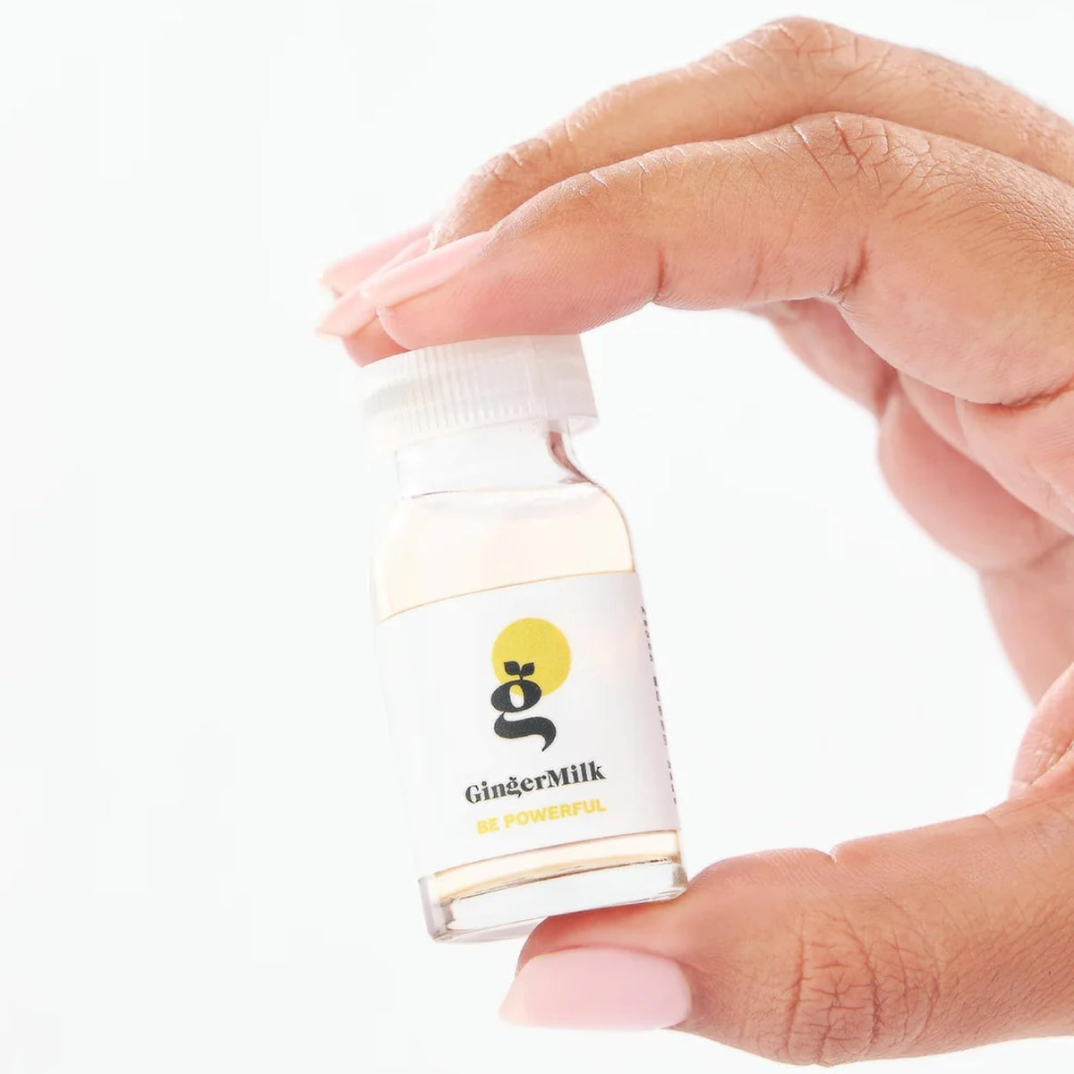 Ginger Milk Natural Care ampoules on bathroom shelf styled for daily routine