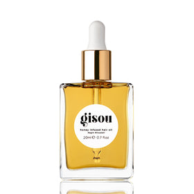 Gisou mini bottle front view showing compact travel-ready shine