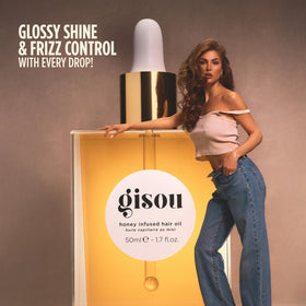 Gisou mini held in hand showing size and portability advantage