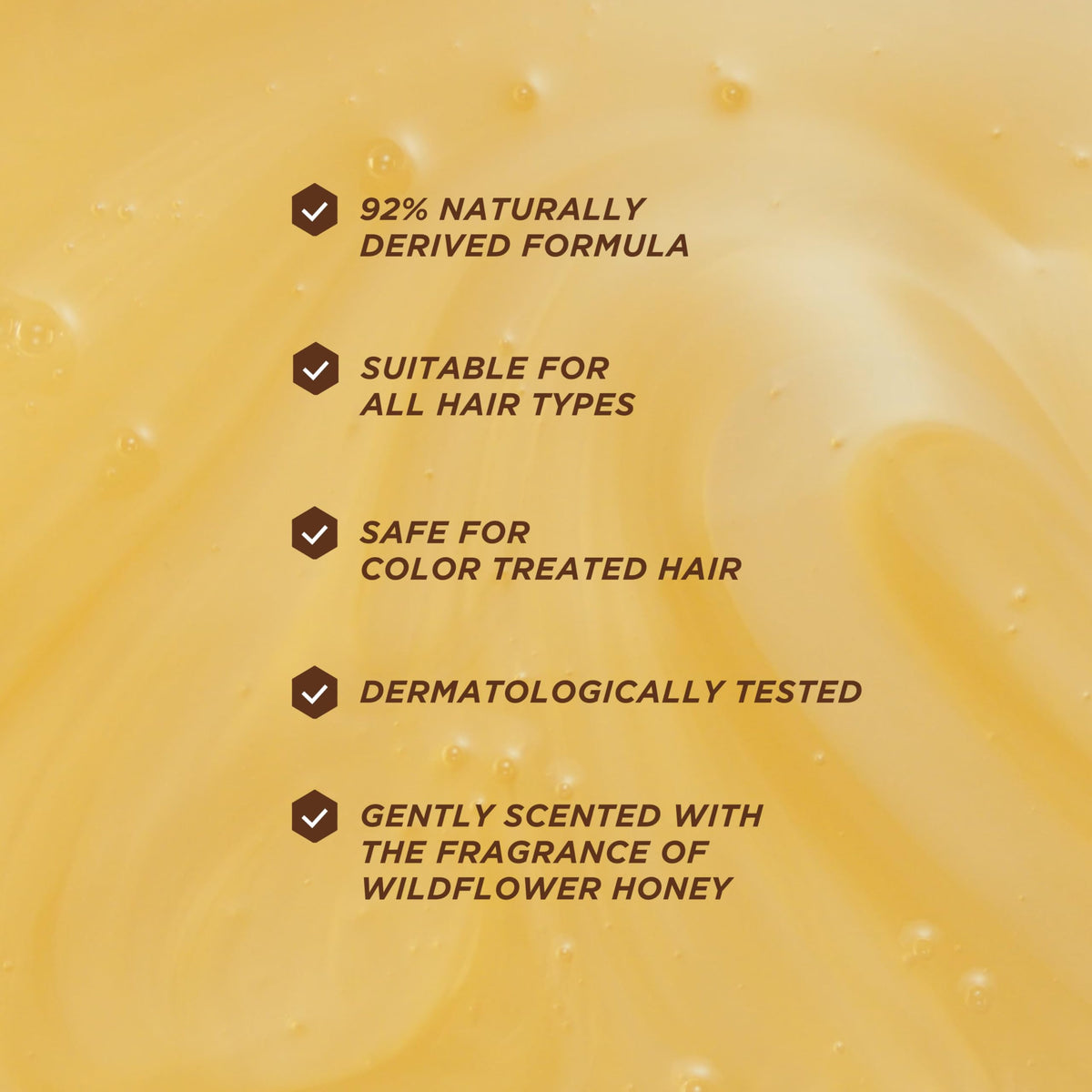 Label close-up of Gisou ingredients highlighting honey, ceramides and AHAs benefits