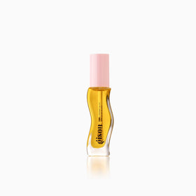 Gisou lip oil layered over lipstick demonstrating amplified shine and color boost