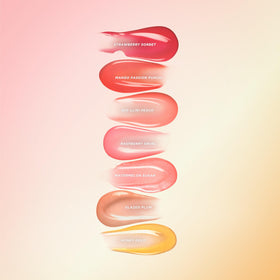 Gisou lip oil next to everyday items to show compact 0.27 fl oz size
