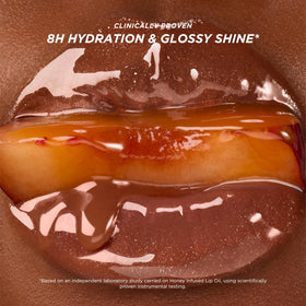 Gisou lip swatch Glazed Plum on model showing hydrated shine