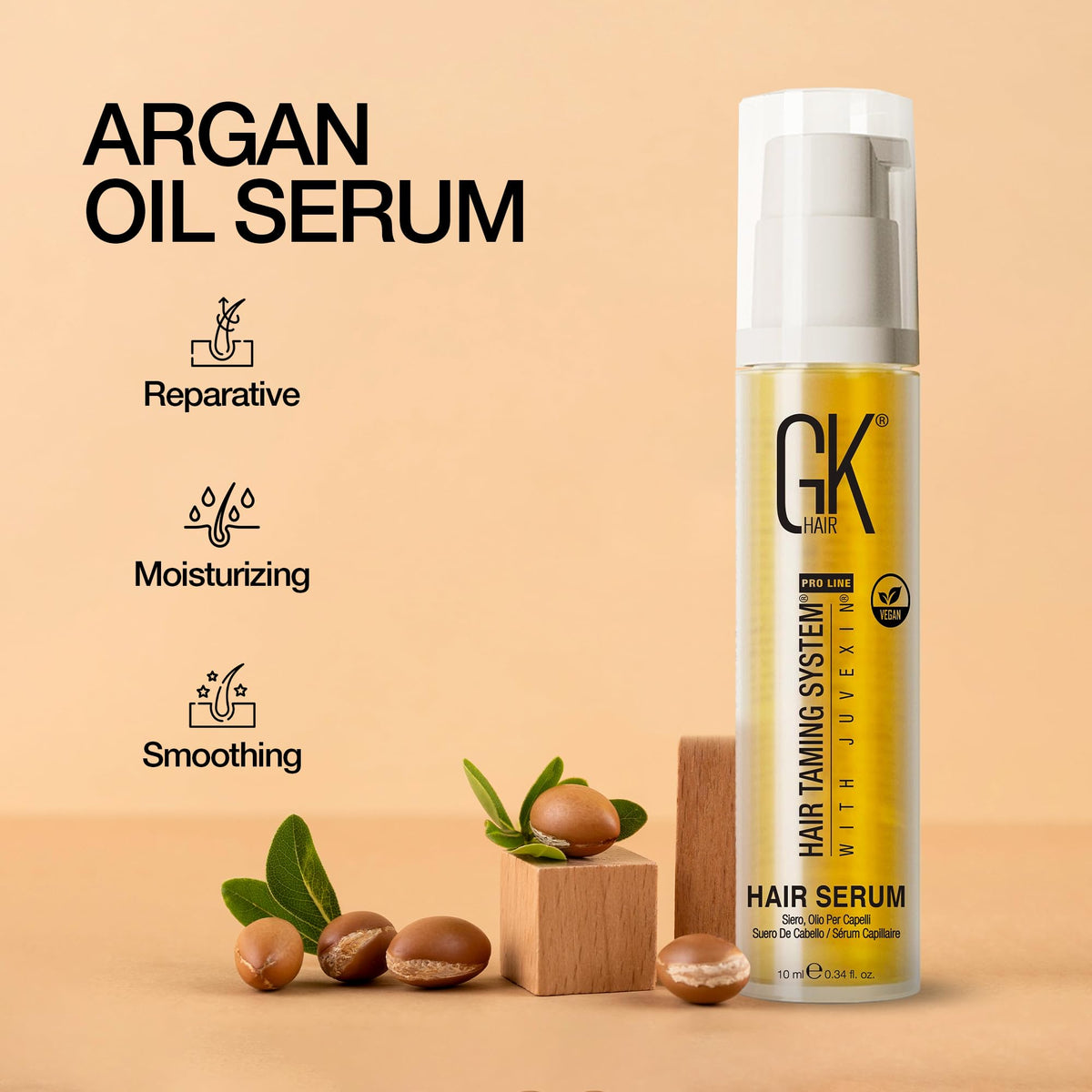 GK HAIR argan oil drop on fingertip highlighting smooth lightweight texture
