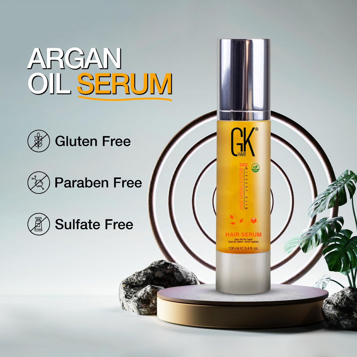 GK HAIR serum beside ruler showing 3.4 oz size for scale and travel convenience