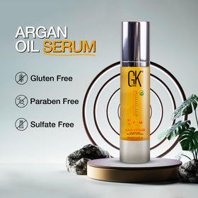 GK HAIR serum beside ruler showing 3.4 oz size for scale and travel convenience