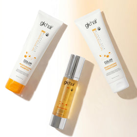 GK HAIR bottles beside a hand showing 3.4 fl oz scale for travel compliance