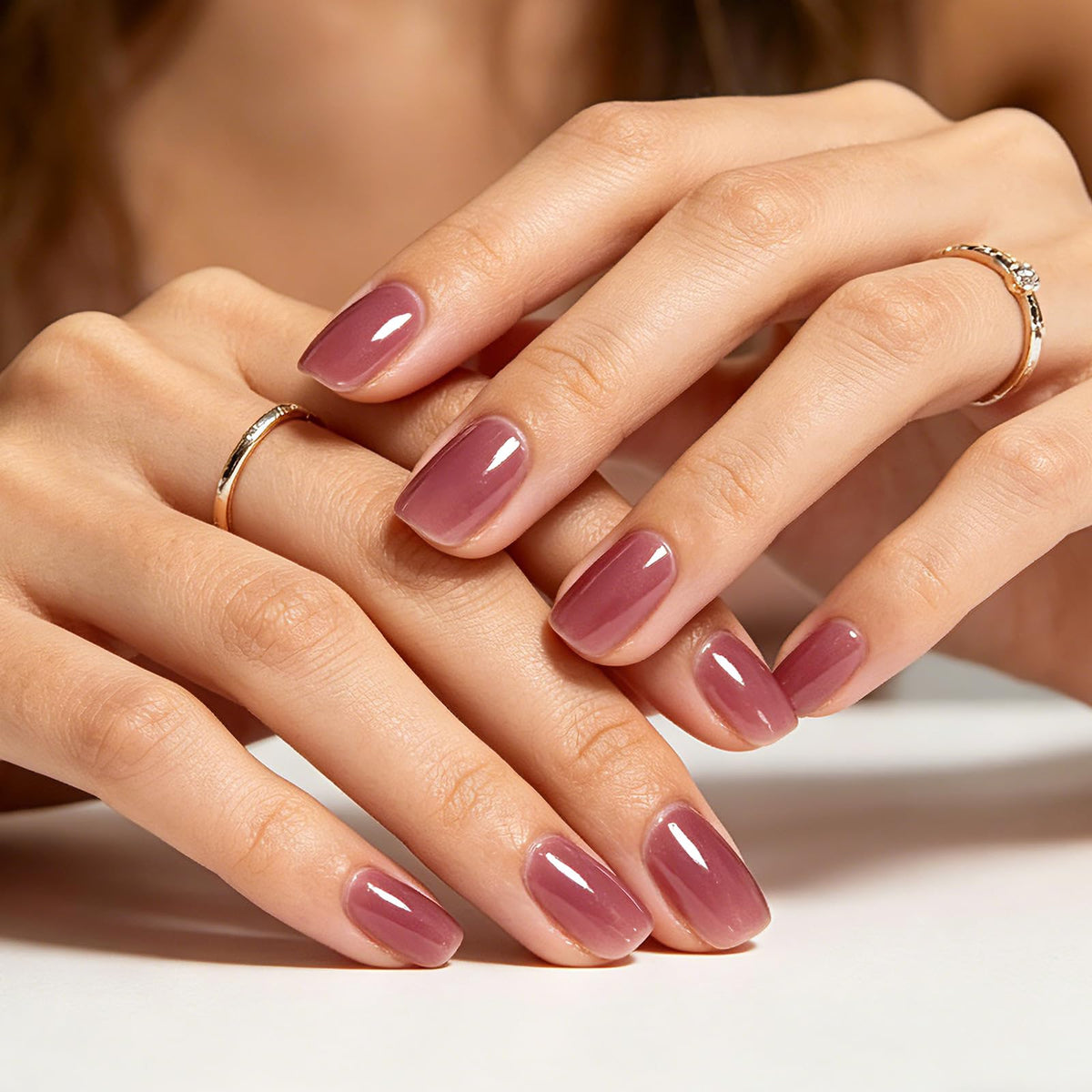 GLAMERMAID lifestyle shot of woman wearing deep rose nails for polished look