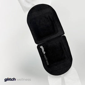 Glitch eye mask on airplane passenger demonstrating TSA-friendly travel relief