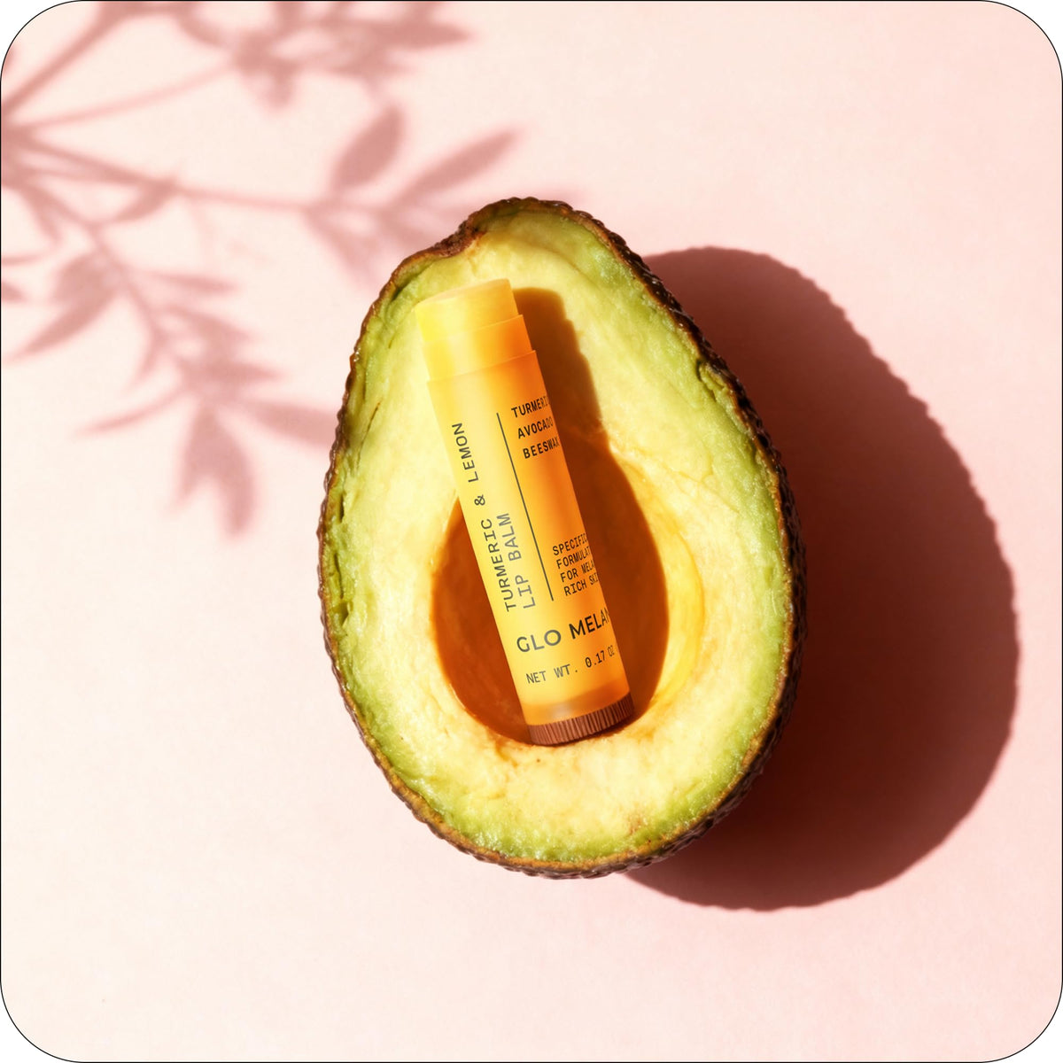 Glo Melanin lip balm in purse for on-the-go touch-ups