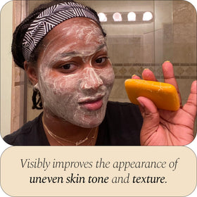 Glo Melanin with fresh turmeric root highlighting natural ingredients